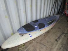 2 windsurfing boards and various sails to container