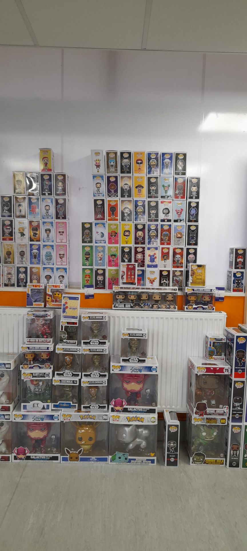 Quantity of Funko POP Collectables (Star Wars, Marvel, Heroes, TV etc.) to floor and wall