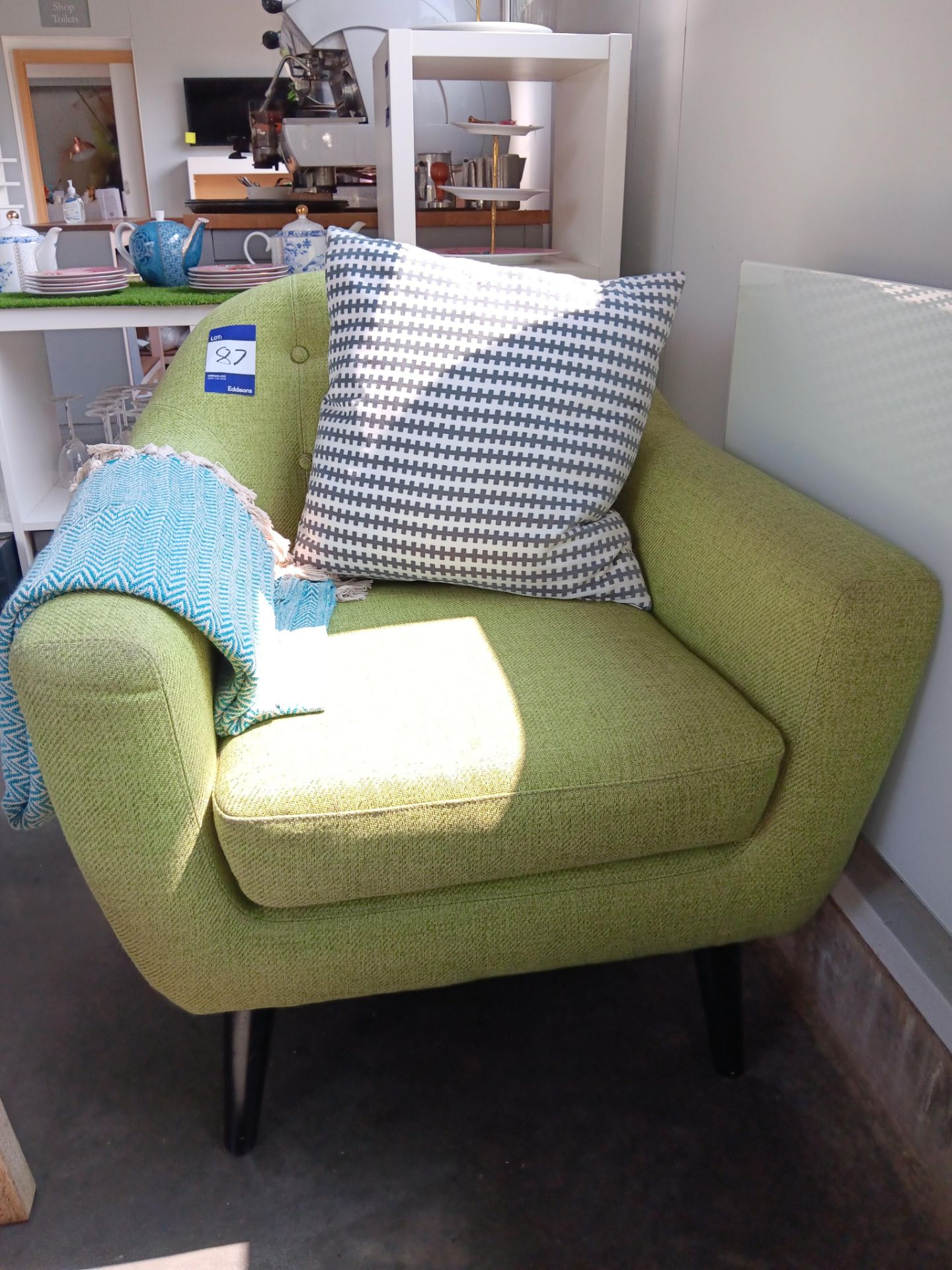 Armchair with green cloth upholstery