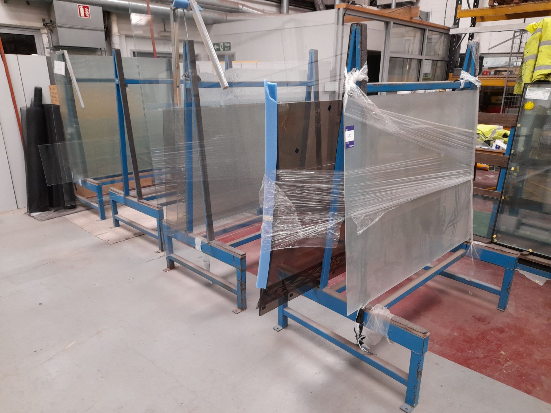 4 double sided glass racks and contents