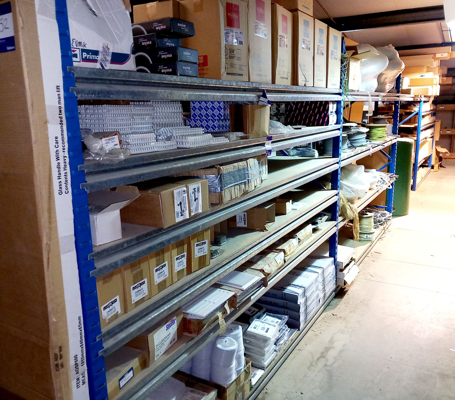 Large quantity of plumbing components to include cable reels, 2 x 9m flexible flue, WC seats,