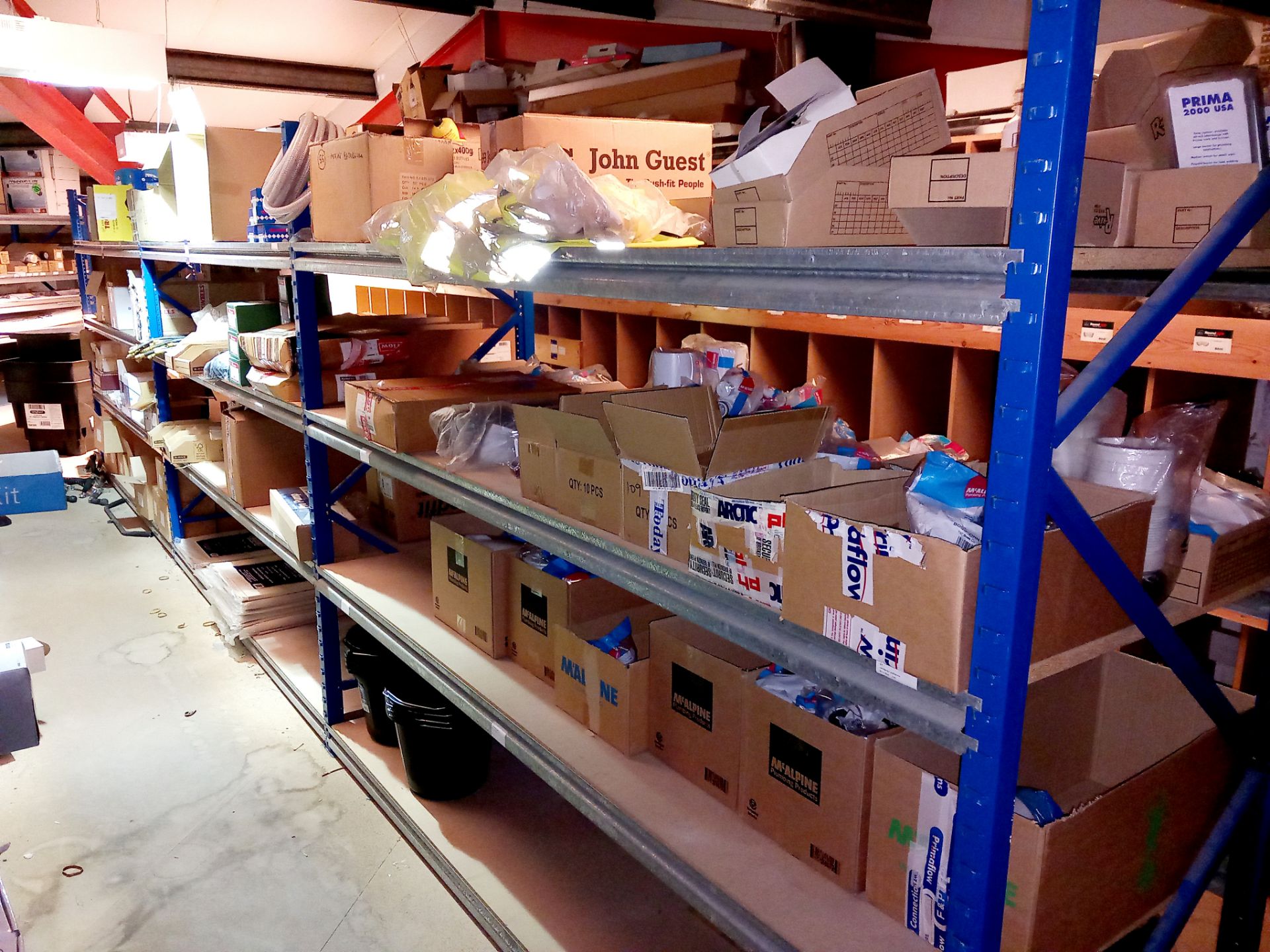 Large quantity of various plumbing/guttering components to pigeon hole shelving (approx. 200