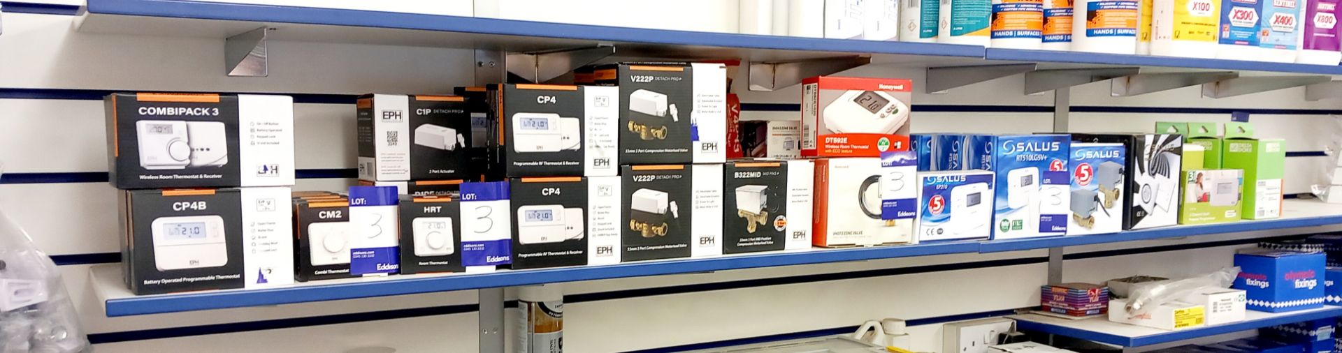 Quantity of various EPH, Honeywell and Salus thermostats and valves to shelf (approx. 50 units).