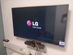 LG 42” Wall Mounted TV with Logitech MeetUp Conference Camera (Buyer to Unsecure & Remove)