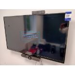 Polaroid 49” Wall Mounted TV with Logitech MeetUp Conference Camera ( Buyer to Unsecure & Remove)