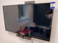 Polaroid 49” Wall Mounted TV with Logitech MeetUp Conference Camera ( Buyer to Unsecure & Remove)
