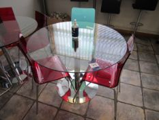 Circular glass topped table with 3 chairs