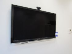 Samsung wall mounted TV (approx. 40”) with remote
