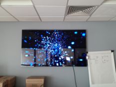 Samsung wall mounted display (approx. 75”) with remote