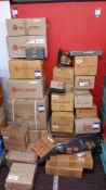 Large quantity of boxed Royal Enfield motorcycle spare parts & accessories to floor/wall