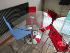 Circular glass topped table with 3 chairs