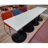 4 x White topped black framed tables (Approx. 600 x 600), with 4 x Nomique Moka Rod Frame chairs (