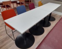4 x White topped black framed tables (Approx. 600 x 600), with 4 x Nomique Moka Rod Frame chairs (