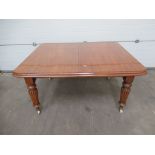Extending Leaf Dining Table raised on castors with 2 x leaves