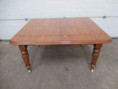 Extending Leaf Dining Table raised on castors with 2 x leaves