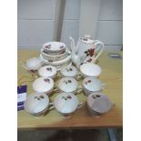 Rose Adorned Tea Service inc. Plates, Teacups, Teapot etc.