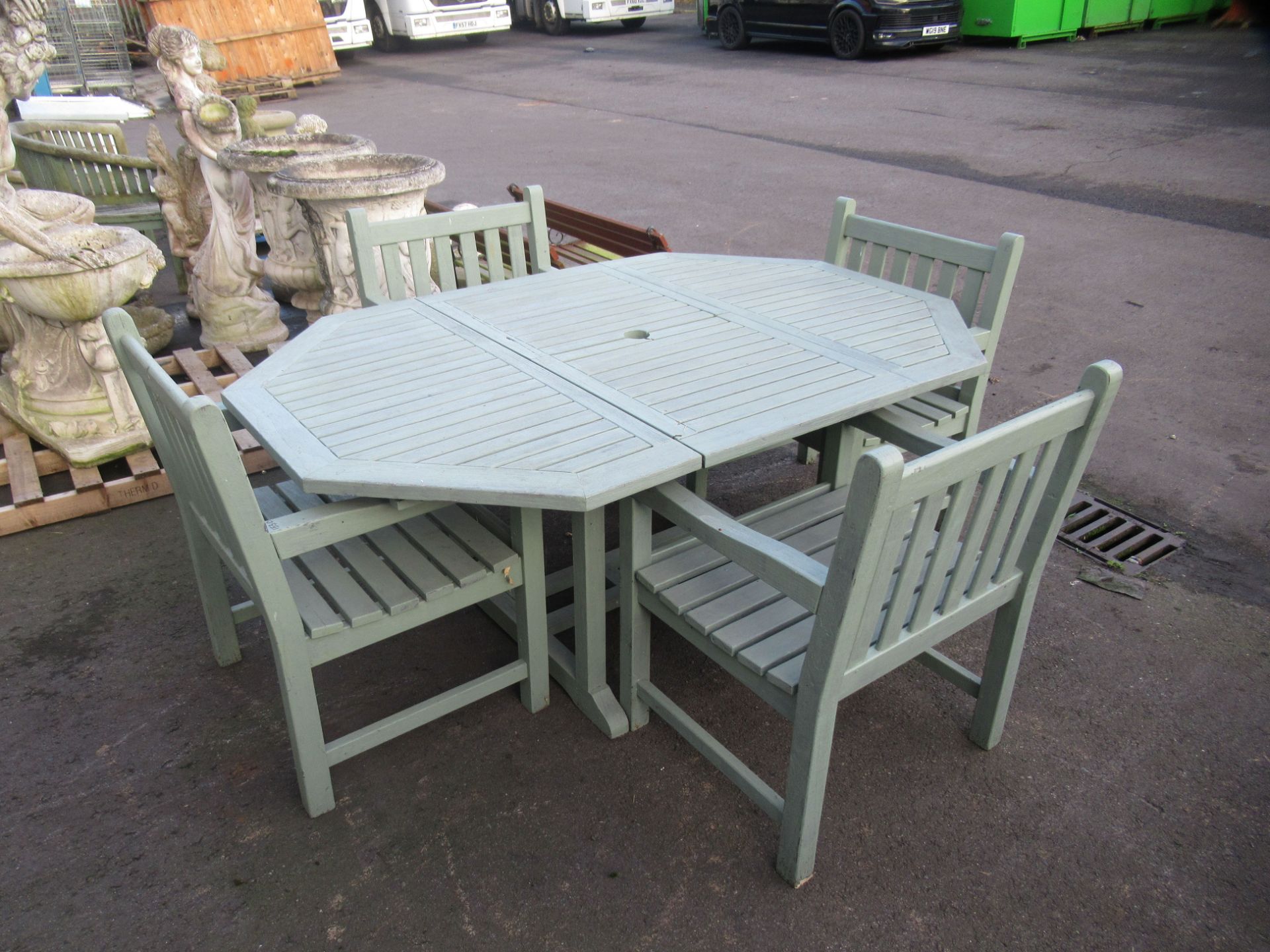 An Extendable Painted Garden Table together with 4 x Chairs