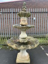 A Large 3Tier Water Fountain Featuring A Child Playing The Pipes