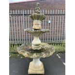 A Large 3Tier Water Fountain Featuring A Child Playing The Pipes