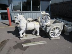 Border stone horse and cart garden ornament.