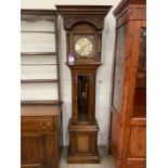 Mahogany Grandfather Clock with Ornate Face Featuring Roman Numerals