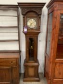 Mahogany Grandfather Clock with Ornate Face Featuring Roman Numerals