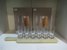 2x Sets of Boxed LSA Bar Lager Glasses Along with An Unboxed LSA Wooden Shots Paddle & Glasses