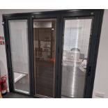 Anthracite grey on white SMART aluminium 3-leaf bi-folding doors, glazed with blinds in-between