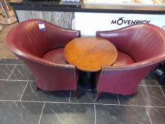 2 x Claret leather tub chairs with circular low level table