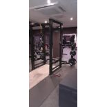 Indigo Fitness 530 power rack UB08C Serial number 28402/10 with quantity of barbell weights to racks