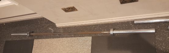 5x Various barbells to floor – Located in Basement