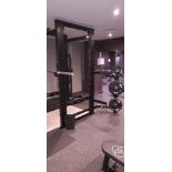 Indigo Fitness 530 power rack UB08C Serial number 28402/10 with quantity of barbell weights to racks