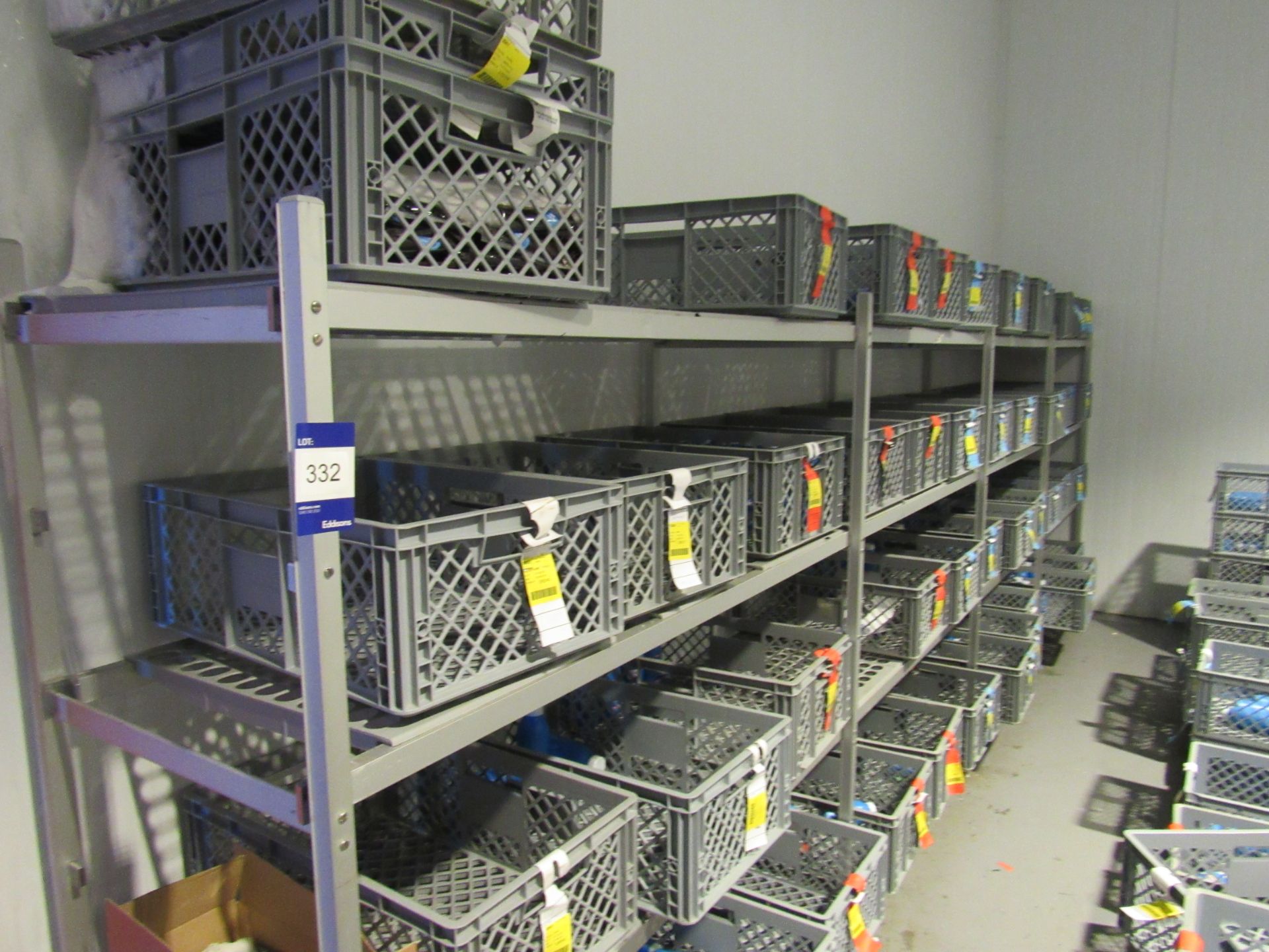 Large quantity of plastic baskets and shelving uni