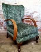 Interior Design - a period Art Deco oak wing back club chair recently upholstered in an emerald