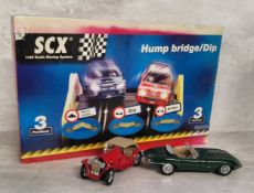 A Tecni Toys SCX 1/32 scale Hump Bridge/Dip set, 3 positions, instructions & original box; a