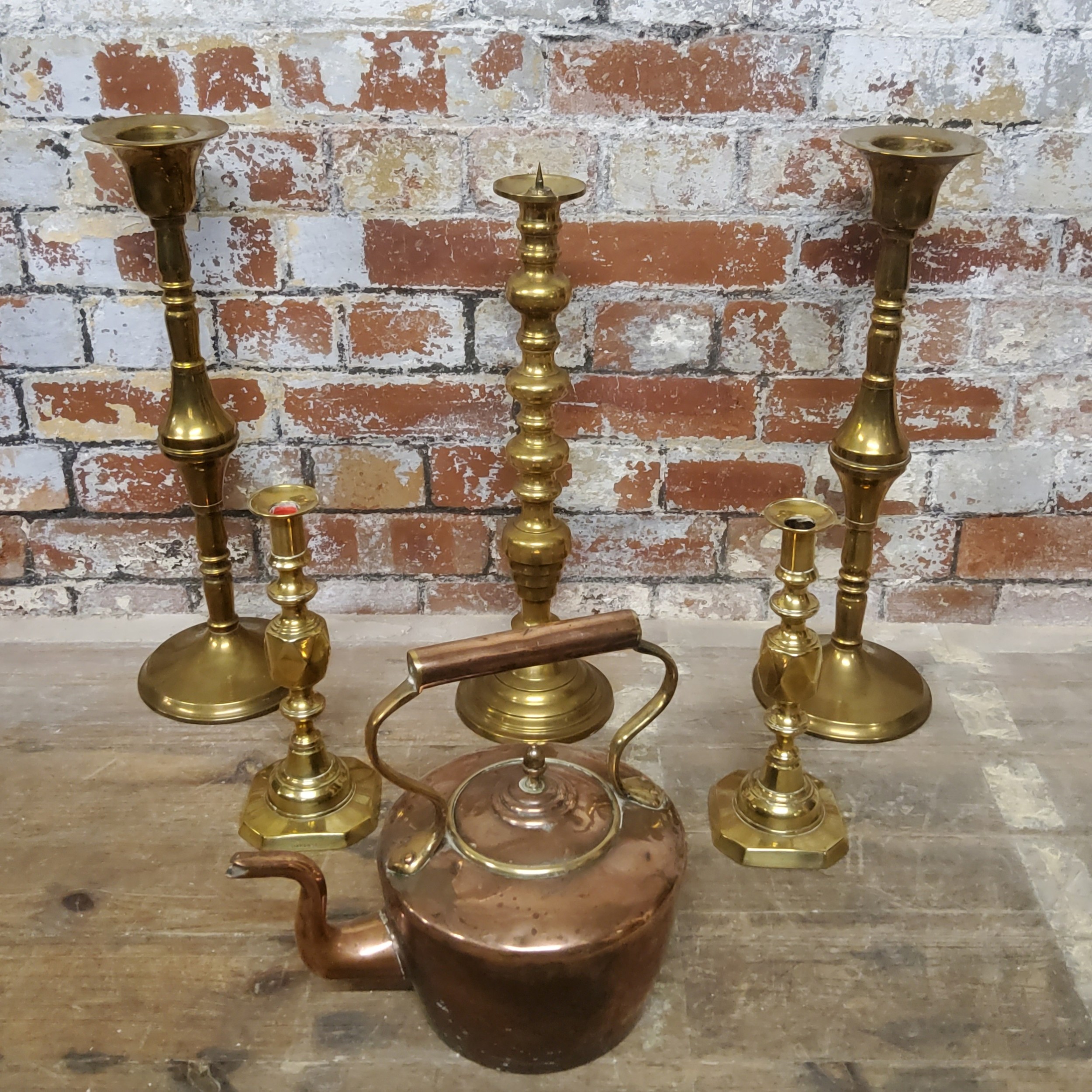 A pair of substantial ecclesiastical brass candlesticks 53.5cms high; a smaller pair of brass