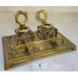 A late 19th century desk top two ink bottle and pen stand deocrated in relief swags & flowers, a