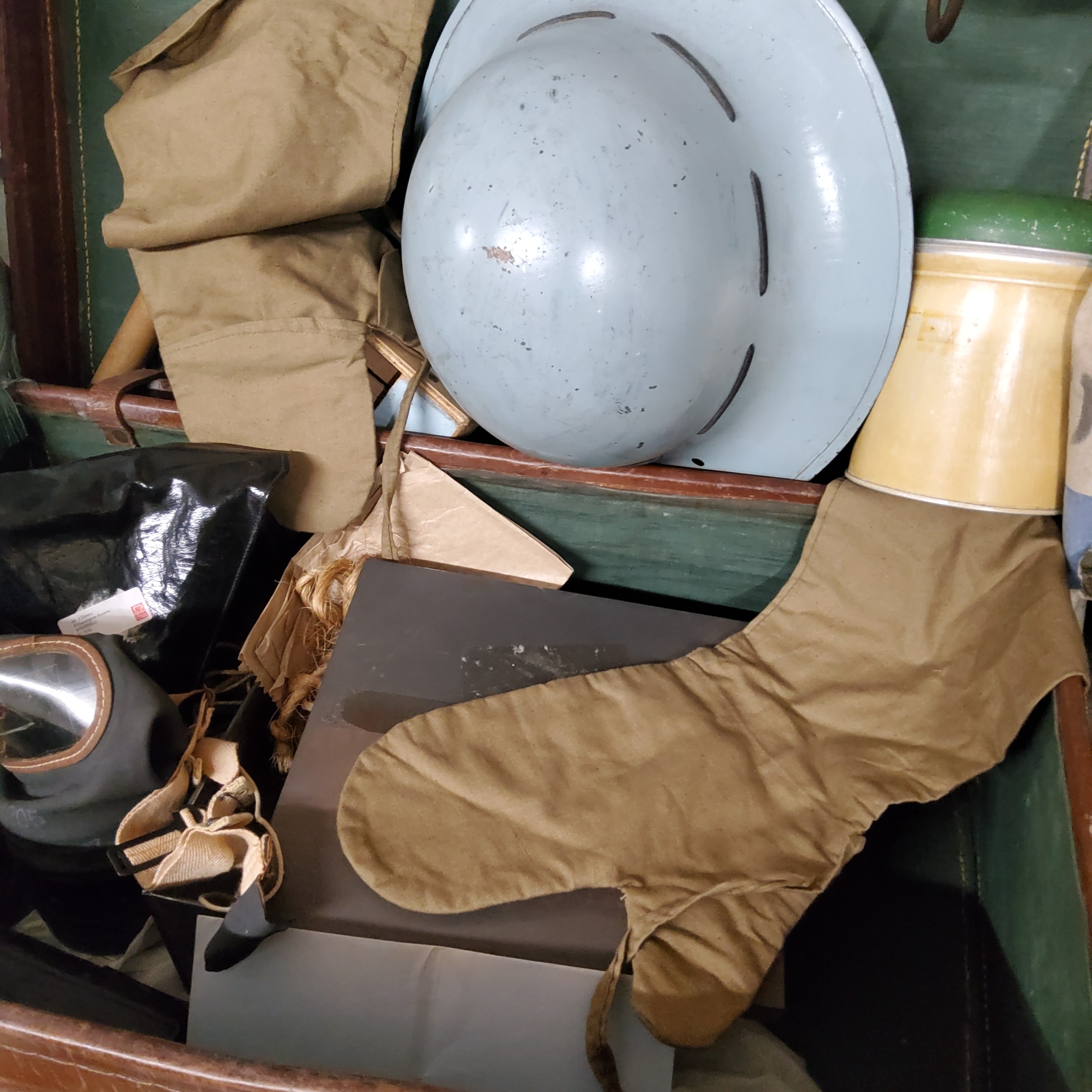 Militaria - two early 20th century leather suitcases containing military woollen mittens, a WWII - Image 2 of 2