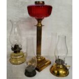 Victorian oil lamp base with cranberry glass reservoir, other oil lanterns, etc