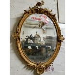 A 19th century Roccoco style looking glass, heavily distressed gesso frame (AF)