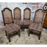 A set of four rattan backed country kitchen chairs, H stretcher, turned legs Height 113cm (seat