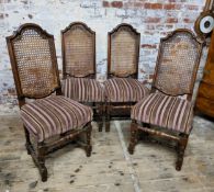 A set of four rattan backed country kitchen chairs, H stretcher, turned legs Height 113cm (seat