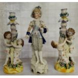 A pair of late 19th century Ernst, Bohne and Sohne figural candlesticks, the two children