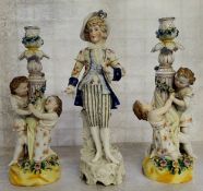 A pair of late 19th century Ernst, Bohne and Sohne figural candlesticks, the two children