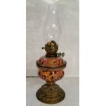 An early 20th century oil lantern, Duplex burner with a tin glazed earthenware reservoir on a