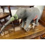 Amended Description - A large Steiff elephant on wheels, grey felt,