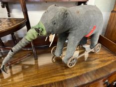 Amended Description - A large Steiff elephant on wheels, grey felt,