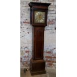 A George III English oak longcase clock, the oversailing ogee hood with decorative fretwork details,