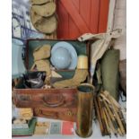 Militaria - two early 20th century leather suitcases containing military woollen mittens, a WWII