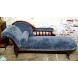 A Victorian mahogany chaise lounge, clean Royal blue upholstery, raised on reeded column legs,